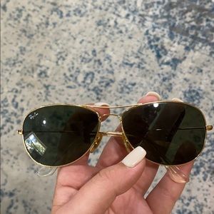 Black and gold trimmed Ray Ban aviators